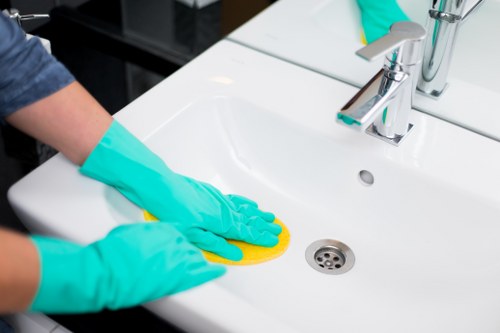 Local office cleaner maintaining an N6 business kitchen